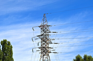 Electric lines pylon on blue sky background