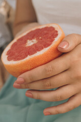 hand with grapefruit