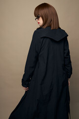 Smiling lady stylish clothes smile laughing on a beige background 