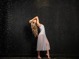 beautiful girl in white on a black background