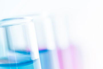 background of defocused test tubes with liquid