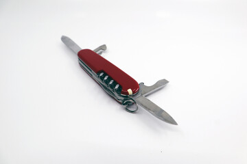 a red military knife for travel and outdoor use.