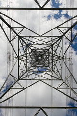 Power lines run vertically through this abstract image of a pylon.