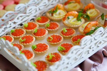 Delicious sandwiches with red caviar