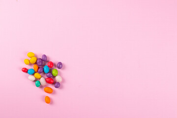yummy sweet colour round lollipops on the pink background. minimalism style. 