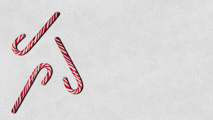 Candy cane. 3 candies on gray background.       