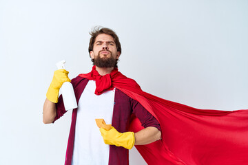 Man with detergent in hands in rubber gloves professional housework cleaning