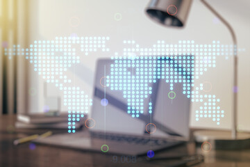 Fototapeta premium Double exposure of abstract digital world map on laptop background, research and strategy concept