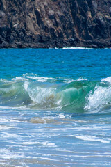 wave crashing with cliffs