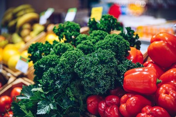 Wooden crates full of fresh colorful vegetables and fruit.