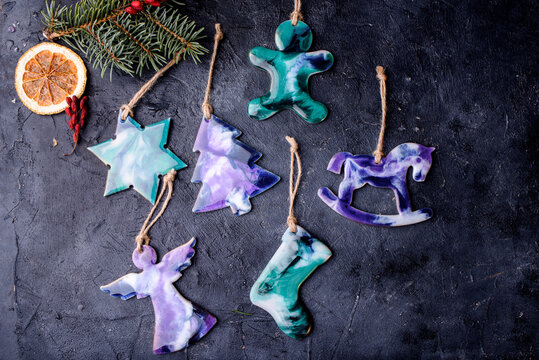 Beautiful toys on the Christmas tree made of epoxy resin Toys handmade. View from above.