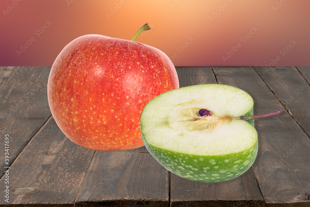 Poster half and whole ripe delicious red apples on wooden background