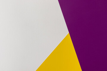 Abstract geometric paper background. White, yellow and purple colors.