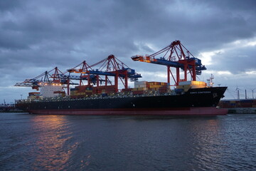 container cargo freight ship with crane - hamburg, elbe