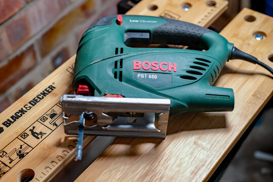 Norwich, Norfolk, UK &ndash; November 17 2020. An illustrative photo of a Bosch handheld power jigsaw on a Black & Decker Workmate bench