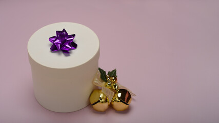 White gift box on pink background 