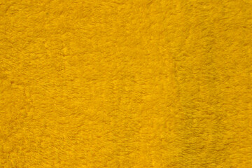 Yellow towels made from cotton or synthetic fabrics.