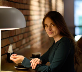 woman using smartphone in cafe