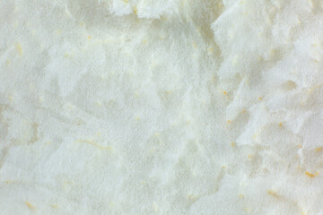 White peel texture inside grapefruit. Beige natural background.
