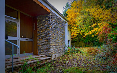 entrance of an abandoned house in autumn