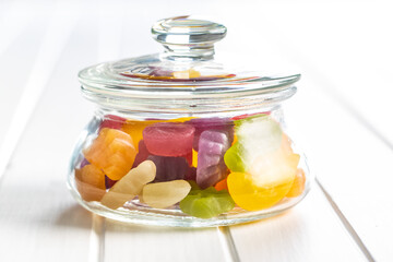 Colorful fruity jelly candies in jar.