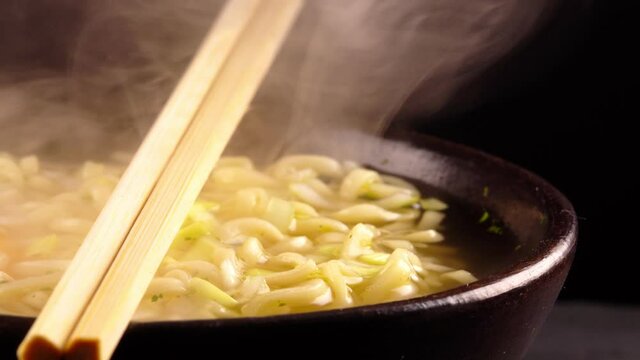 Bowl with classical chinese hot noodle soup.