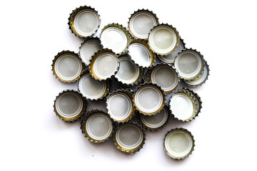 Many soda bottle caps on endless white ground, no alchool yes life, 
The word life, consisting of alcohol caps, 
isolated used glass bottle caps made of metal on white ground 