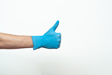 Doctor hand with glove showing like gesture or thumbup as approval, accept or done concept. Copy space. place for text