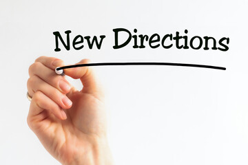 Hand writing inscription New Directions with marker, concept