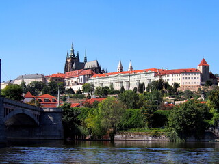 view of Prague from the deck of a steamer, historical city center, panorama on the Vltava, sunny summer day, tourism