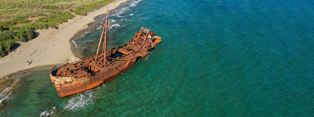 Aerial drone ultra wide photo of famous abandoned old rusty shipwreck of Dimitrios in Selinitsa bay...