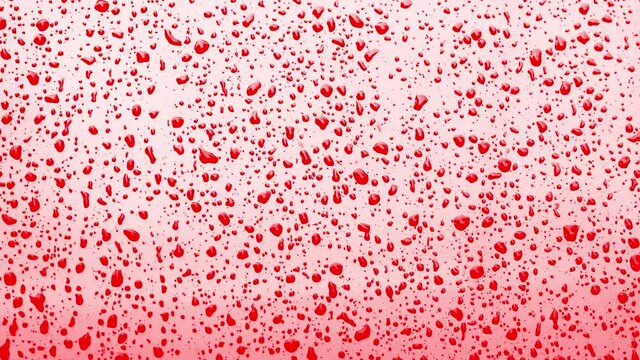 Abstract red blood drops on surface background.