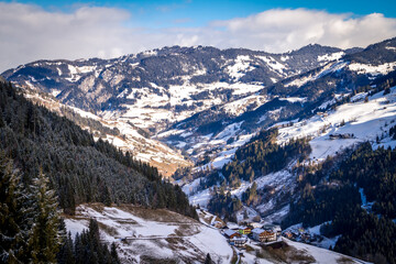 typical Austrian houses against the backdrop of the Gastein valley. Sports region Bad Gastein, Austrian Alps.