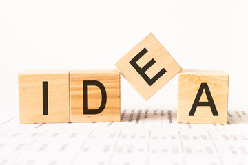 Word idea. Wooden small cubes with letters isolated on white background with copy space available.Business Concept image.