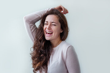 Naklejka premium Happy girl smiling. Beauty portrait young happy positive brunette woman isolated on white background. Young european woman portrait, true emotions.