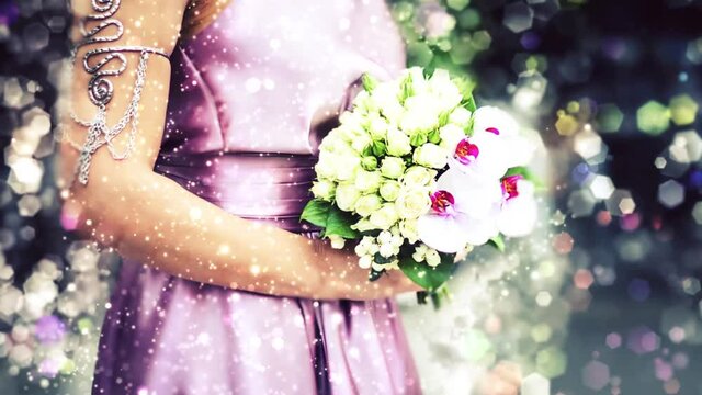  video of Bride in pink dress holding wedding bouquet shimming effect with bokeh