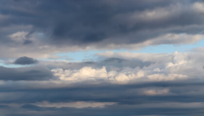 Stunning mixed cloud formation panorama in a summer sky