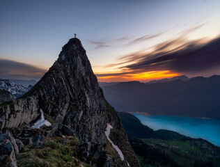 Man's silhouette on mountain top