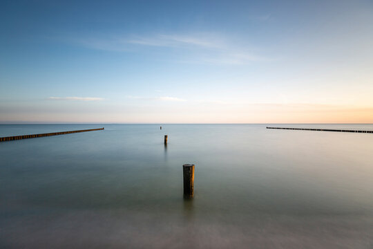 Groyne on coast of Baltic Sea at dawn