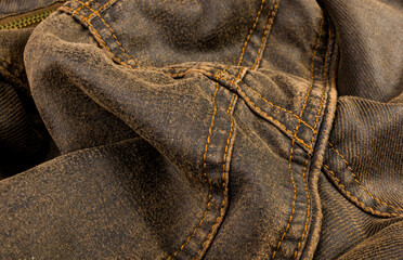 Naklejka premium clothing items stonewashed cotton fabric texture with seams, clasps, buttons and rivets, macro