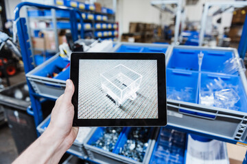 Hand holding digital tablet with image of a product