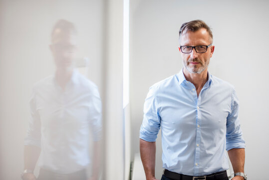 Portrait of confident mature businessman in office