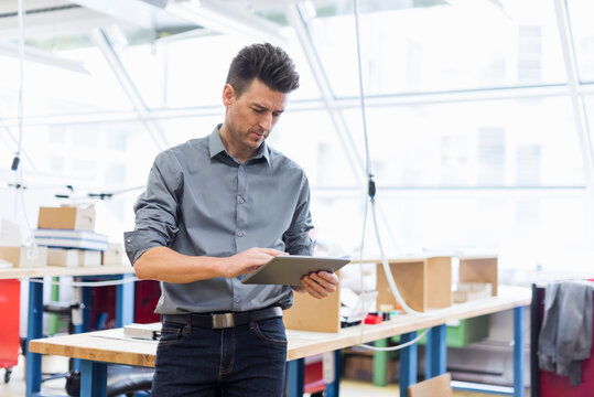 Man using tablet in factory