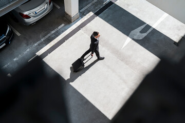 Top view of businessman with baggage on the go
