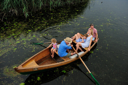 Family in rowing boat on lake