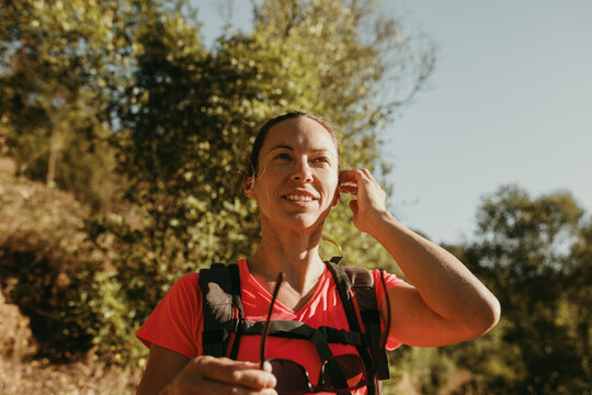 Smiling woman exploring Sierra De Hornachuelos, Cordoba, Spain