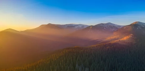 Foto auf Alu-Dibond The sun's rays illuminate the mountain tops and the fog at dawn. © maykal