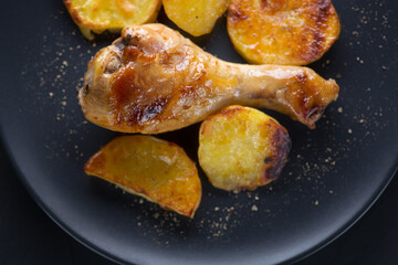 Baked chicken with potatoes.