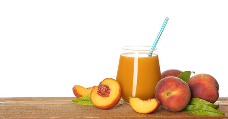 Natural freshly made peach juice on wooden table, white background