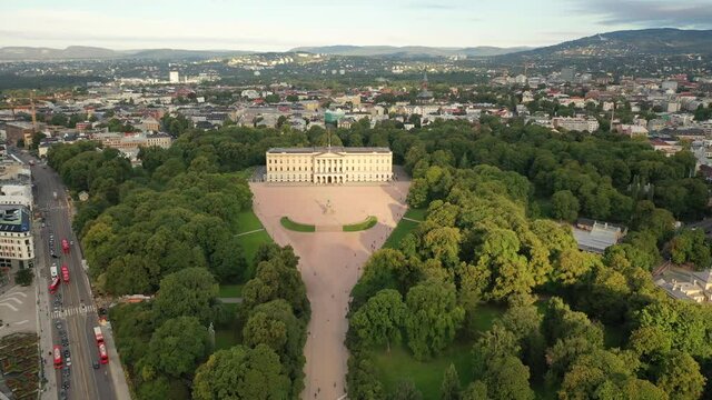 Oslo, Norway. Beautiful 4K panoramic aerial video from flying drone to Oslo of the Royal Palace and Statue of King Karl Johan. In the background the castle park, the city and the mountains (Series)